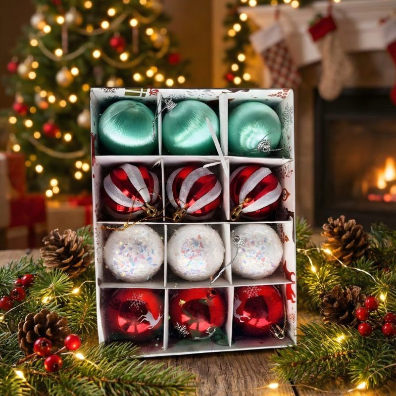 Box of 12 assorted Christmas ornaments featuring red reindeer, candy cane swirl, white snowball, and mint green designs inside packaging.