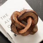 Handcrafted Triple Knot Wooden Accent Piece in natural finish, rustic table decor.