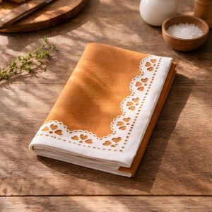 Texture shot of 100% cotton Terracotta Bloom napkin by Glimpse Homes showing the fabric grain and printed design.