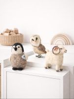 Close-up of Glimpse Homes handmade felt owl, penguin, and ram toys standing on a white shelf as nursery decor.