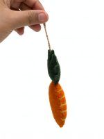 Felt carrot ornament for nursery decor, side angle showing jute thread stitching