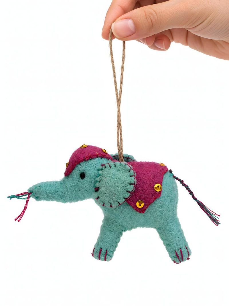 Glimpse Homes felt elephant ornament with pink embroidered saddle and gold sequins