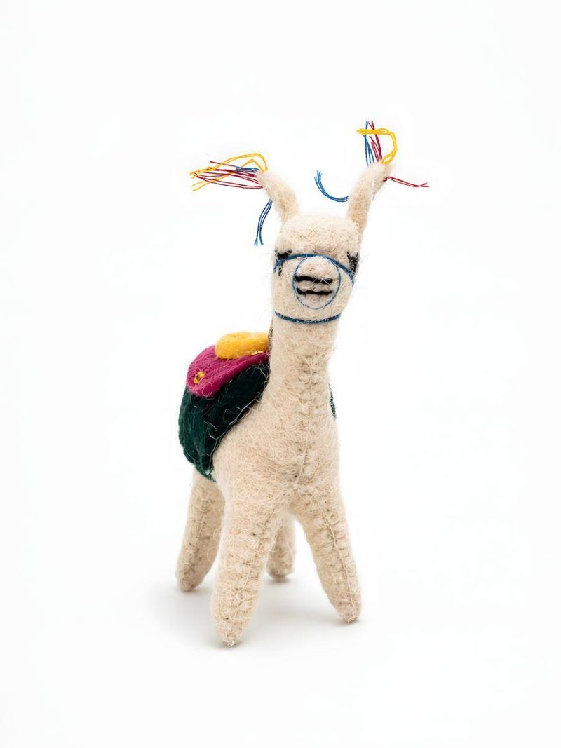 Front view of Glimpse Homes felt llama toy ornament with embroidered bridle and colorful mane