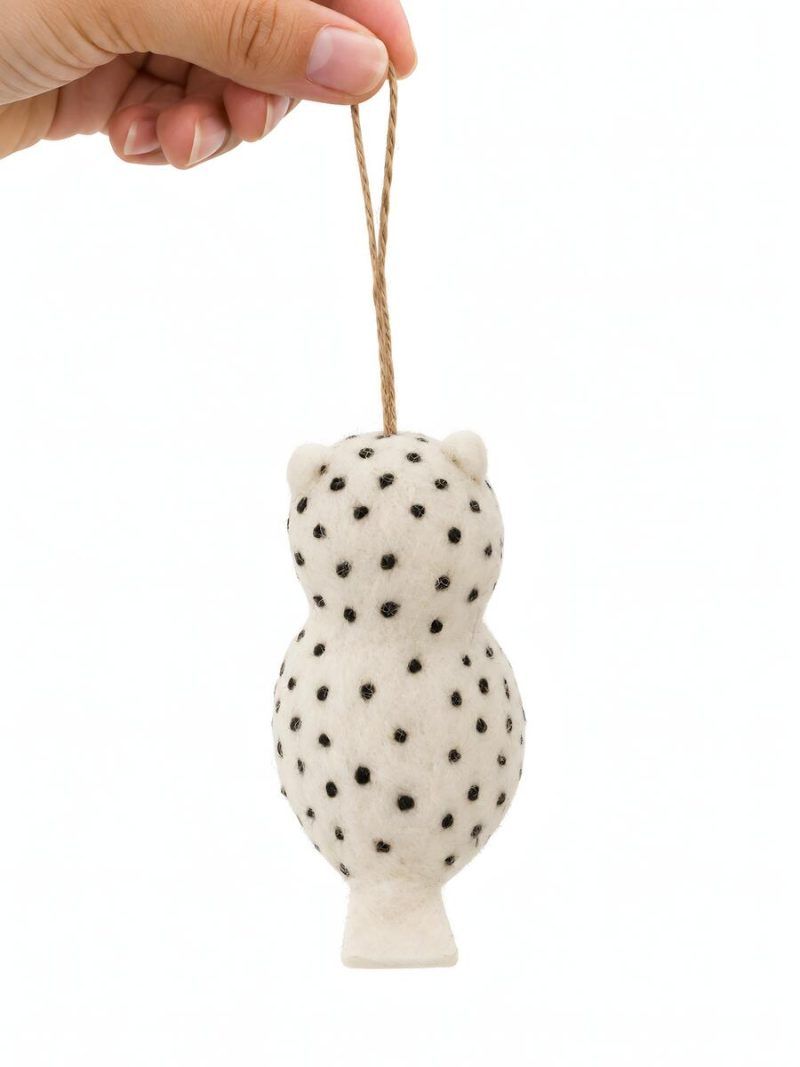 Back view of felt owl nursery ornament with black polka dot detailing by Glimpse Homes