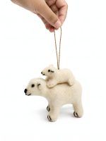 Glimpse Homes felt polar bear ornament with baby cub on its back, held by hand