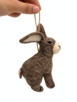 Hand holding a felt rabbit ornament to show size, brown wool felt bunny décor