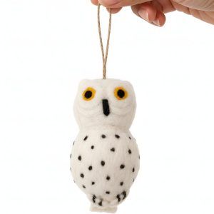 Front view of Glimpse Homes felt snowy owl ornament with orange embroidered eyes and polka dot body