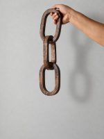 Hand holding 3 Knot Long Wooden Chain Sculpture in Walnut Finish – Glimpse Homes decorative accent.
