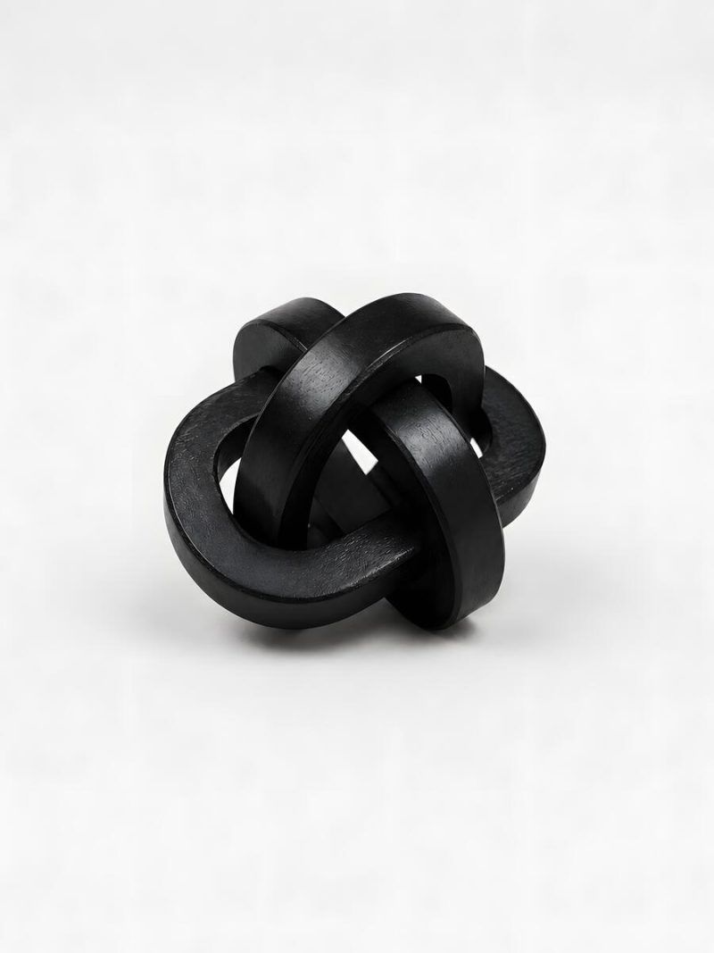 Glimpse Homes small black wooden triple knot decorative accent piece on white background.